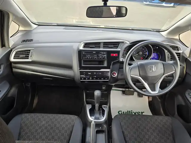 ホンダ フィット 13G Fパッケージ 鹿児島県 2015(平27)年 6.1万km クリスタルブラックパール CDプレイヤー/FM/AM/AUX/シガーソケット/パワーウィンドウ/パワーステアリング/スペアキー/ドアバイザー/電動格納ミラー/スマートキー/プッシュスタート/オートAC/Wエアバック/横滑り防止装置/純正フロアマット/ワンオーナー/ABS/アイドリングストップ/盗難防止装置