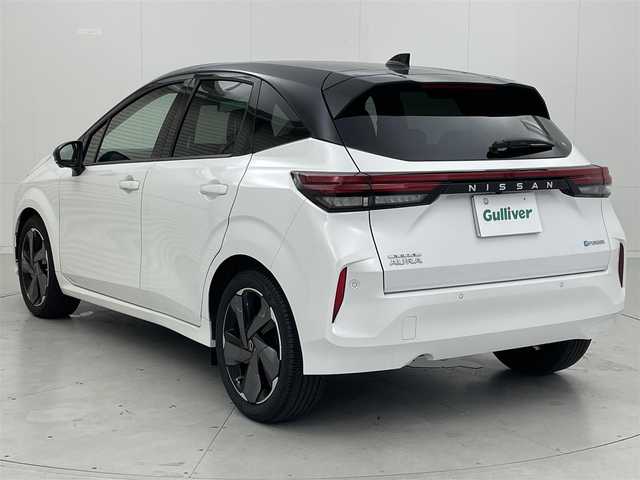 日産 オーラ G レザーエディション 茨城県 2024(令6)年 0.5万km ピュアホワイトパール / スーパーブラック 2トーン 純正9型ナビ/BOSEパーソナルプラスサウンドシステム/全方位カメラ/HDMI/フルセグ/プロパイロット/置くだけ充電/衝突被害軽減ブレーキ/車線逸脱抑制装置/ソナー/BSW/ETC2.0/デジタルインナーミラー/本革シート/純正17インチAW/LEDヘッドライト/スマートキー