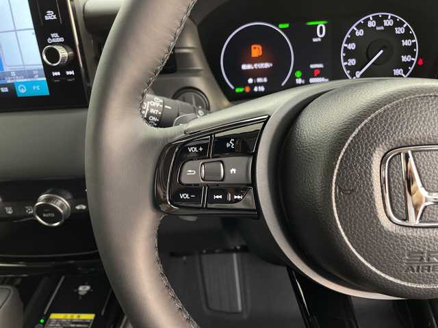 ホンダ ヴェゼル ハイブリッド e:HEV Z 鹿児島県 2025(令7)年 0.1千km クリスタルブラックパール 登録済未使用車/ホンダセンシング/レーダークルーズコントロール/ビルトインETC2・0/バックカメラ/純正ナビ/(BT/AM/FM/フルセグTV)/Applecarplay/Androidauto/革巻きステアリング/ステアリングスイッチ/ステアリングヒーター/電動リアゲート/チップアップシート/ハーフレザーシート/前席シートヒーター/純正18インチアルミホイール/レーンキープアシスト/オートマチックハイビーム/ブラインドスポットモニター/純正LEDヘッドライト/ワイヤレス充電/電動パーキングブレーキ/オートホールド/前後コーナーセンサー/保証書/取扱説明書/スペアキー