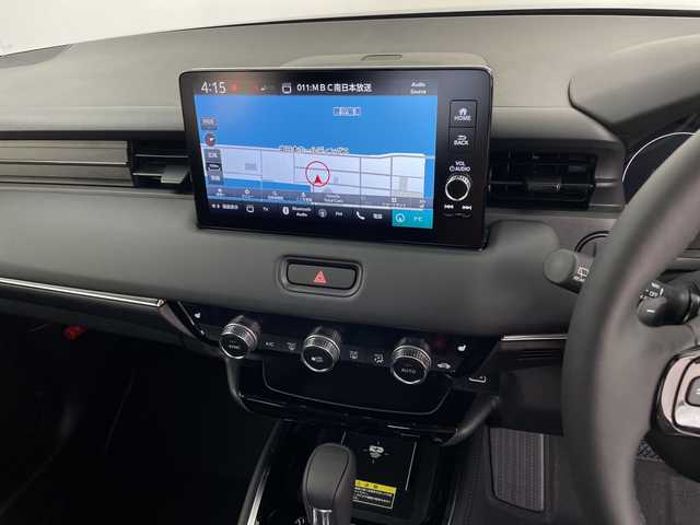 ホンダ ヴェゼル ハイブリッド e:HEV Z 鹿児島県 2025(令7)年 0.1千km クリスタルブラックパール 登録済未使用車/ホンダセンシング/レーダークルーズコントロール/ビルトインETC2・0/バックカメラ/純正ナビ/(BT/AM/FM/フルセグTV)/Applecarplay/Androidauto/革巻きステアリング/ステアリングスイッチ/ステアリングヒーター/電動リアゲート/チップアップシート/ハーフレザーシート/前席シートヒーター/純正18インチアルミホイール/レーンキープアシスト/オートマチックハイビーム/ブラインドスポットモニター/純正LEDヘッドライト/ワイヤレス充電/電動パーキングブレーキ/オートホールド/前後コーナーセンサー/保証書/取扱説明書/スペアキー