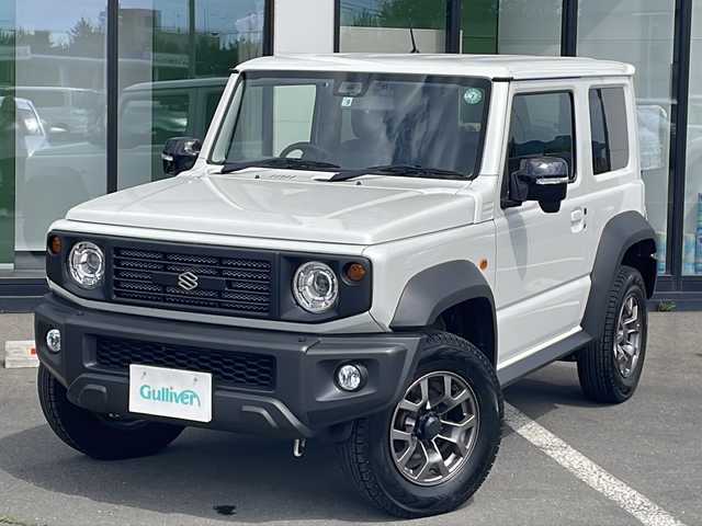 スズキ ジムニー シエラ JC 道東・釧路十勝 2022(令4)年 4.2万km ピュアホワイトP ・4WD/・純正液晶オーディオ【PVH‐９５００DVSZS】/(FM/AM.BT.iPod.AUX)/・衝突被害軽減システム/・クルーズコントロール/・ダウンヒルアシストコントロール/・車線逸脱警報/・横滑り防止/・ETC/・OPFグリル/・LEDヘッドライト/・フロントフォグライト/・USB入力端子/・ドライブレコーダー 前方/・シートヒーター/・純正フロアマット/・本革巻きステアリング/・取扱説明書/・保証書