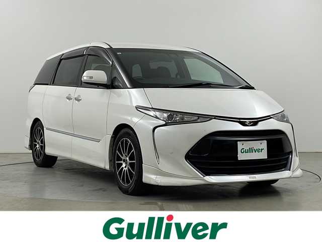 トヨタ エスティマ アエラス プレミアム 道央・札幌 2016(平28)年 8.4万km ホワイトパールクリスタルシャイン ・４WD / 寒冷地仕様/・トヨタセーフティセンス/・プリクラッシュセーフティ/・フロントワイパーデアイサー/・純正ディーラーOP9インチナビ/・DVD.CD.SD.Bluetooth/・フルセグ/バックカメラ/・両側パワースライドドア/・オットマンシート（二列目）/・ハーフレザーシート/・LEDライト/オートハイビーム/・クリアランスソナー/・ビルトインETC/・ローダウン（社外車高調）/・純正アルミ付きサマータイヤ積込/・スマートキー
