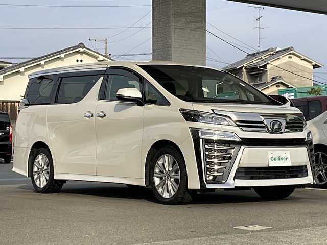 トヨタ ヴェルファイア Z 愛媛県 2018(平30)年 7.9万km ホワイトパールクリスタルシャイン ワンオーナー /ディーラーOPナビ/・フルセグTV/・Bluetooth接続/・CD、DVD再生/・SDミュージックサーバー/ToyotaSafetySense/・衝突軽減ブレーキ/・レーンアシスト/・レーダークルーズ/・先行車両発信アラート/・オートハイビーム/ビルトインETC/純正フリップダウンモニター/両側パワースライドドア/前後ドライブレコーダー/2列目オットマン/スペアキー/保証書/取扱説明書