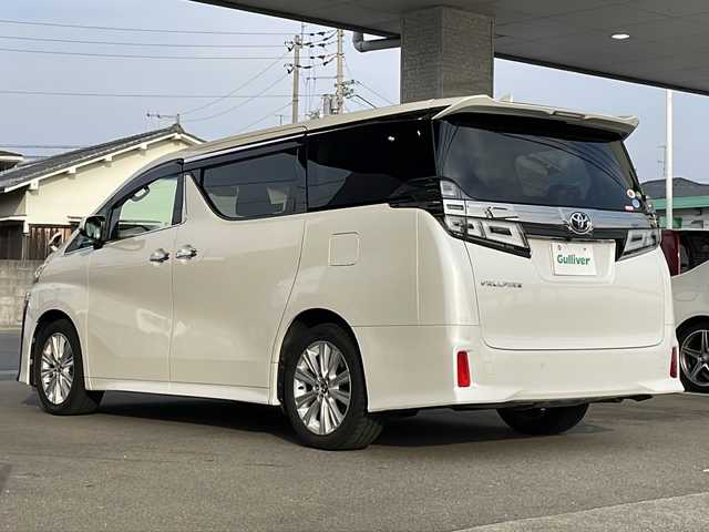 トヨタ ヴェルファイア Z 愛媛県 2018(平30)年 7.9万km ホワイトパールクリスタルシャイン ワンオーナー /ディーラーOPナビ/・フルセグTV/・Bluetooth接続/・CD、DVD再生/・SDミュージックサーバー/ToyotaSafetySense/・衝突軽減ブレーキ/・レーンアシスト/・レーダークルーズ/・先行車両発信アラート/・オートハイビーム/ビルトインETC/純正フリップダウンモニター/両側パワースライドドア/前後ドライブレコーダー/2列目オットマン/スペアキー/保証書/取扱説明書