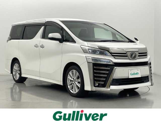 トヨタ ヴェルファイア Z 熊本県 2018(平30)年 8万km ホワイトパールクリスタルシャイン ワンオーナー /ディーラーOPナビNSZT-Y68T/・フルセグTV/・Bluetooth接続/・CD、DVD再生/・SDミュージックサーバー/ToyotaSafetySense/・衝突軽減ブレーキ/・レーンアシスト/・レーダークルーズ/・先行車両発信アラート/・オートハイビーム/ビルトインETC/純正フリップダウンモニター/両側パワースライドドア/前後ドライブレコーダー/2列目オットマン/純正フロアマット/純正１８インチAW/オートライト/LEDヘッドライト/フォグライト/スマートキー/プッシュスタート/スペアキー1本/保証書/取扱説明書