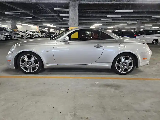 トヨタ ソアラ 430SCV ノーブルカラーED 長崎県 2005(平17)年 9.4万km コスモシルバー 純正ナビ/TV/マークレビンソンプレミアムサウンド/バックカメラ/クルーズコントロール/横滑り防止装置/HIDヘッドランプ/オートライト/オートエアコン/本木製/革巻きコンビステアリング/ステアリングスイッチ/ノーブルレッド革シート/前席パワーシート/ポジションメモリー/前席シートヒーター/社外18インチAWスタッドレス/リモコンキー/イモビライザー/オートアラーム/禁煙車