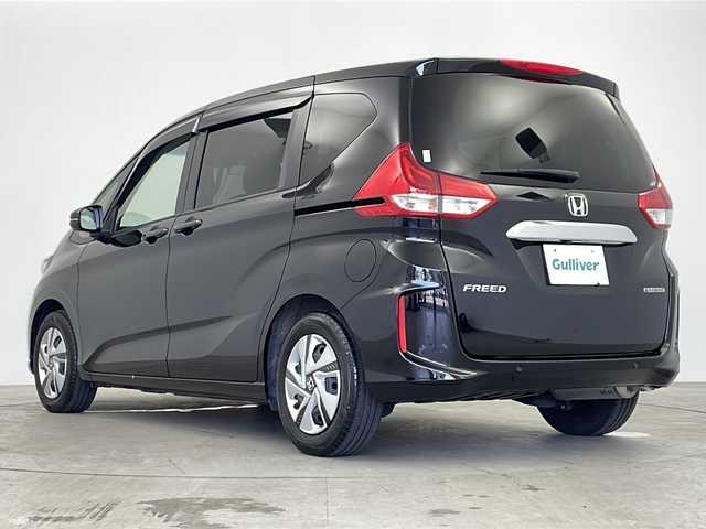 ホンダ フリード ハイブリット G 鹿児島県 2022(令4)年 1.9万km クリスタルブラックパール 純正９型ナビ　/（フルセグ/Ｂｌｕｅｔｏｏｔｈ/CD/DVD)　/アダプティブクルーズコントロール　/両側パワースライドドア　/バックカメラ　/オートライト　/ステアリングリモコン　/ビルドインＥＴＣ　/リアサンシェード　/シートヒーター/LEDヘッドライト/保証書/取扱説明書