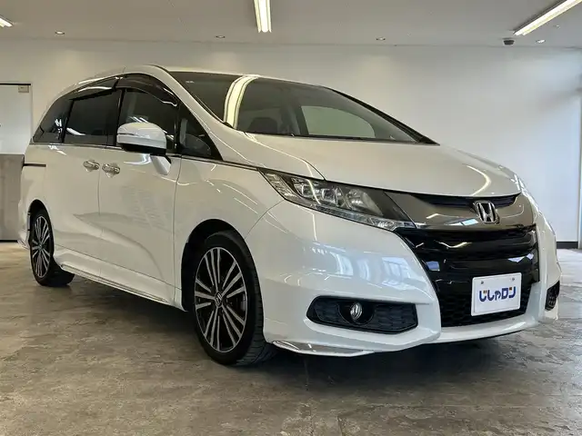 ホンダ オデッセイ アブソルート 20thアニバーサリー 静岡県 2015(平27)年 10.8万km ホワイトオーキッドパール (株)IDOMが運営する【じしゃロン浜松店】の自社ローン専用車両になりますこちらは現金またはオートローンご利用時の価格です。自社ローンご希望の方は別途その旨お申付け下さい/純正ナビ（VXM-155VFEi)/CD/DVD/AM/FM/Bluetooth/バックカメラ/両側パワースライドドア/LEDヘッドライト/LEDルームランプ/Honda　SENSING/●誤発進抑制機能/●先行車発進お知らせ機能/●標識認識機能/●LKAS〈車線維持支援システム〉/●路外逸脱抑制機能/●ACC〈アダプティブ・クルーズ・コントロール〉