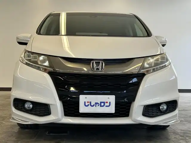 ホンダ オデッセイ アブソルート 20thアニバーサリー 静岡県 2015(平27)年 10.8万km ホワイトオーキッドパール (株)IDOMが運営する【じしゃロン浜松店】の自社ローン専用車両になりますこちらは現金またはオートローンご利用時の価格です。自社ローンご希望の方は別途その旨お申付け下さい/純正ナビ（VXM-155VFEi)/CD/DVD/AM/FM/Bluetooth/バックカメラ/両側パワースライドドア/LEDヘッドライト/LEDルームランプ/Honda　SENSING/●誤発進抑制機能/●先行車発進お知らせ機能/●標識認識機能/●LKAS〈車線維持支援システム〉/●路外逸脱抑制機能/●ACC〈アダプティブ・クルーズ・コントロール〉