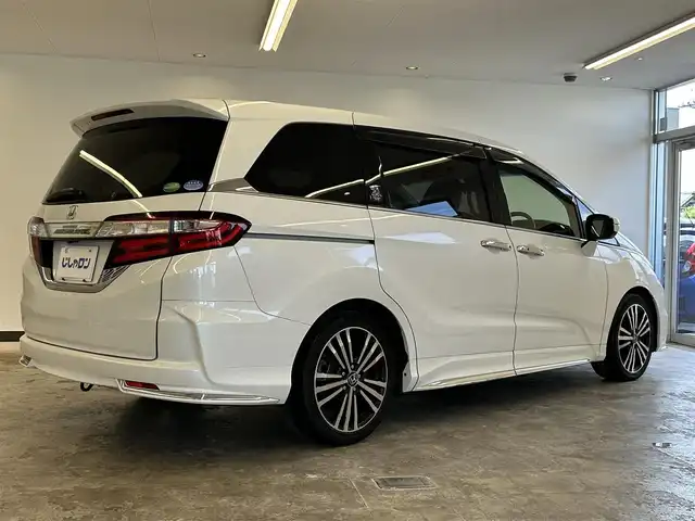 ホンダ オデッセイ アブソルート 20thアニバーサリー 静岡県 2015(平27)年 10.8万km ホワイトオーキッドパール (株)IDOMが運営する【じしゃロン浜松店】の自社ローン専用車両になりますこちらは現金またはオートローンご利用時の価格です。自社ローンご希望の方は別途その旨お申付け下さい/純正ナビ（VXM-155VFEi)/CD/DVD/AM/FM/Bluetooth/バックカメラ/両側パワースライドドア/LEDヘッドライト/LEDルームランプ/Honda　SENSING/●誤発進抑制機能/●先行車発進お知らせ機能/●標識認識機能/●LKAS〈車線維持支援システム〉/●路外逸脱抑制機能/●ACC〈アダプティブ・クルーズ・コントロール〉