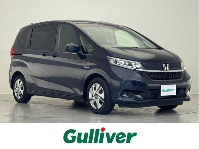 ホンダ フリード ハイブリット G ホンダセンシング 滋賀県 2020(令2)年 2.5万km ミッドナイトブルービームM 禁煙車/純正９型ナビ/【Ｂｌｕｅｔｏｏｔｈ/フルセグＴＶ/CD/DVD/HDMI】/ビルトインＥＴＣ/バックカメラ/ドライブレコーダー/両側パワースライドドア/ホンダセンシング/・衝突軽減ブレーキ/・歩行者事故低減ステアリング/・アダプティブクルーズコントロール/・車線維持支援システム/・路外逸脱抑制機能/・誤発進抑制機能/・先行車発進お知らせ機能/・標識認識機能/シートヒーター/ＬＥＤライト/スマートキー/ステアリングスイッチ/リアソナー/オートリトラミラー