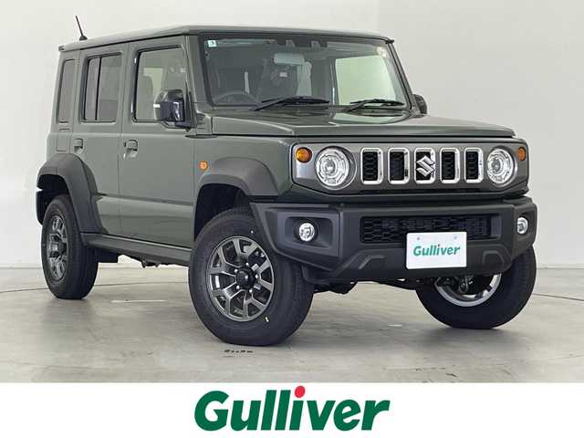 スズキ ジムニー ノマド FC 群馬県 2025(令7)年 0.1万km未満 Ｄグリーン ・登録済未使用車(登録時走行距離：46km)/純正9インチナビ/・AM/FM/CD/DVD/SD/Bluetooth/フルセグTV/バックカメラ/デュアルカメラブレーキサポート/車線逸脱警報/ふらつき警報/後退時ブレーキサポート/アダプティブクルーズコントロール/ハイビームアシスト/標識認識機能/誤発進/後方誤発進抑制機能/先行車発進お知らせ機能/ヒルディセントコントロール/LEDヘッドランプ/ヘッドランプウォッシャー/前席パワーシート/純正15インチアルミホイール