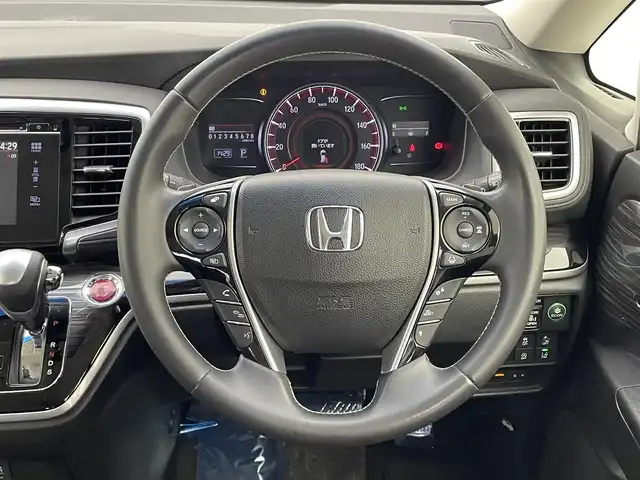 ホンダ オデッセイ アブソルート・EXホンダセンジング 宮城県 2016(平28)年 5.3万km クリスタルブラックパール 純正インターナビ　/フリップダウンモニター　/全周囲カメラ　/両側パワースライドドア　/アダプティブクルーズコントロール/衝突軽減ブレーキ　/レーンキープアシスト　/誤発進抑制機能　/ＬＥＤヘッドライト　/ブラインドスポットインフォメーション　/大型アームレスト　/運転席8wayパワーシート　/ハーフレザーシート/後席オットマン/ビルトインETC/純正18インチAW/禁煙車