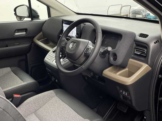 ホンダ フリード ハイブリット e:HEV AIR EX 兵庫県 2025(令7)年 0.1千km クリスタルブラックパール ・未使用車/・純正9インチナビ/・BT・TV・Apple Car Play・AndroidAuto/・両側パワースライドドア/・CMBS/・ACC/・レーンキープアシスト/・ブラインドスポットインフォメーション/・標識認識機能/・シートヒーター/・ハーフレザー/・オートマチックハイビーム/・LEDヘッドライト/・革巻きステアリング/・ステアリングリモコン/・プッシュスタート/・スペアキー/・電動パーキングブレーキ/・オートブレーキホールド/・純正15インチアルミホール