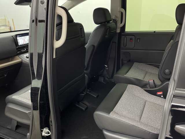 ホンダ フリード ハイブリット e:HEV AIR EX 兵庫県 2025(令7)年 0.1千km クリスタルブラックパール ・未使用車/・純正9インチナビ/・BT・TV・Apple Car Play・AndroidAuto/・両側パワースライドドア/・CMBS/・ACC/・レーンキープアシスト/・ブラインドスポットインフォメーション/・標識認識機能/・シートヒーター/・ハーフレザー/・オートマチックハイビーム/・LEDヘッドライト/・革巻きステアリング/・ステアリングリモコン/・プッシュスタート/・スペアキー/・電動パーキングブレーキ/・オートブレーキホールド/・純正15インチアルミホール