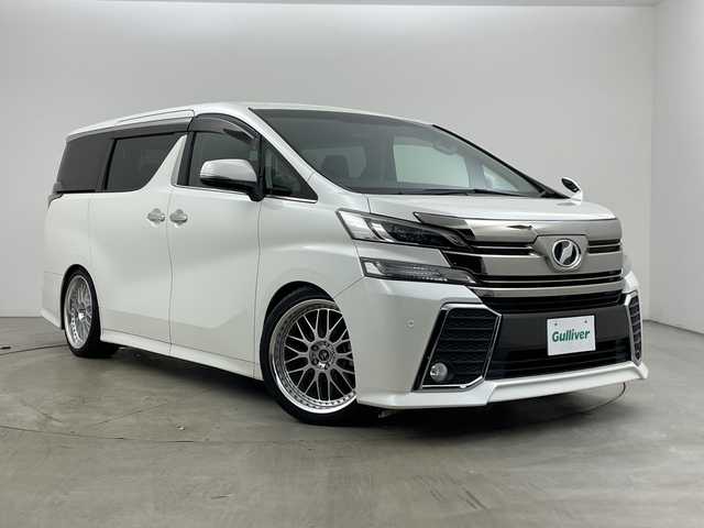 トヨタ ヴェルファイア Z 兵庫県 2015(平27)年 5万km ホワイトパールクリスタルシャイン ・社外10インチナビ（CN-F1X10BGD）/CD/DVD/Blu-ray/TV/SD/USB/HDMI/・バックカメラ/・純正11インチフリップダウンモニター（V11T-R62C）/・ビルトインETC/・両側パワースライドドア/・社外デジタルインナーミラー型前後ドライブレコーダー/・AC１００V電源/・社外車高調/・社外20インチアルミホイール/・nanoe/・LEDヘッドライト/・オートライト/・フォグランプ/・スマートキー/・プッシュスタート