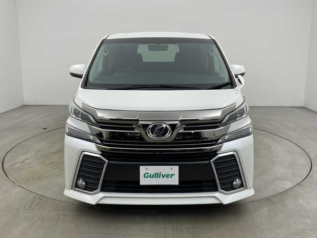 トヨタ ヴェルファイア Z 兵庫県 2015(平27)年 5万km ホワイトパールクリスタルシャイン ・社外10インチナビ（CN-F1X10BGD）/CD/DVD/Blu-ray/TV/SD/USB/HDMI/・バックカメラ/・純正11インチフリップダウンモニター（V11T-R62C）/・ビルトインETC/・両側パワースライドドア/・社外デジタルインナーミラー型前後ドライブレコーダー/・AC１００V電源/・社外車高調/・社外20インチアルミホイール/・nanoe/・LEDヘッドライト/・オートライト/・フォグランプ/・スマートキー/・プッシュスタート