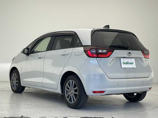 ホンダ フィット e:HEVホーム 沖縄県 2021(令3)年 4.7万km プレミアムサンライトホワイトパール 純正8インチナビ（VXM-215VFEi）/フルセグ/Ｂｌｕｅｔｏｏ/ＣＤ/ＤＶＤ/ＵＳＢ　/バックカメラ/ＥＴＣ　/クルーズコントロール　/チップアップシート　/ハーフレザーシート　/電格ミラー　/前後コーナーセンサー/純正15インチAW/純正フロアマット/プッシュスタート/スマートキ―/スペアキー