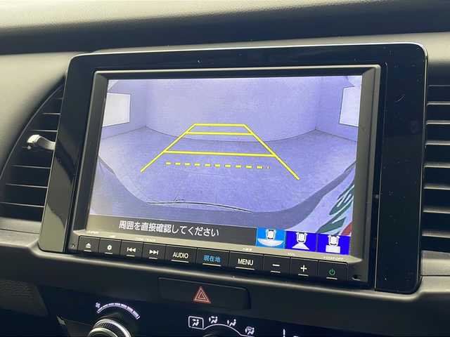 ホンダ フィット e:HEVホーム 沖縄県 2021(令3)年 4.7万km プレミアムサンライトホワイトパール 純正8インチナビ（VXM-215VFEi）/フルセグ/Ｂｌｕｅｔｏｏ/ＣＤ/ＤＶＤ/ＵＳＢ　/バックカメラ/ＥＴＣ　/クルーズコントロール　/チップアップシート　/ハーフレザーシート　/電格ミラー　/前後コーナーセンサー/純正15インチAW/純正フロアマット/プッシュスタート/スマートキ―/スペアキー