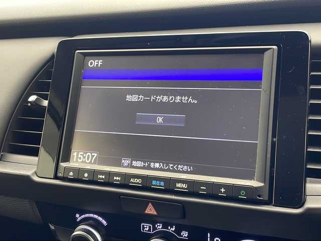 ホンダ フィット e:HEVホーム 沖縄県 2021(令3)年 4.7万km プレミアムサンライトホワイトパール 純正8インチナビ（VXM-215VFEi）/フルセグ/Ｂｌｕｅｔｏｏ/ＣＤ/ＤＶＤ/ＵＳＢ　/バックカメラ/ＥＴＣ　/クルーズコントロール　/チップアップシート　/ハーフレザーシート　/電格ミラー　/前後コーナーセンサー/純正15インチAW/純正フロアマット/プッシュスタート/スマートキ―/スペアキー