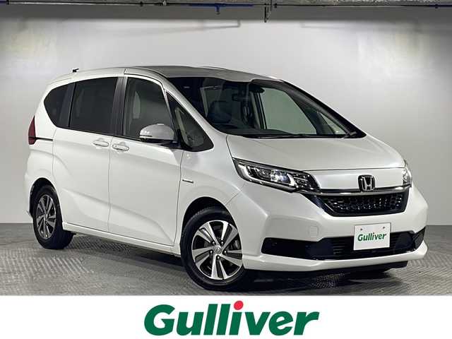ホンダ フリード ハイブリット G ホンダセンシング 沖縄県 2020(令2)年 4万km プラチナホワイトパール 県外仕入/禁煙車/6人乗り/純正ナビ/　フルセグTV/Bluetooth/CD/DVD/ナビ装着用スペシャルパッケージ/両側パワースライドドア/ホンダセンシング/・衝突軽減ブレーキシステム/・路外逸脱抑制機能/・オートクルーズコントロール/前後ドラレコ/Cパッケージ/Sパッケージ/LEDヘッドライト/スマートキー/プッシュスタート/ETC/ハーフレザーシート