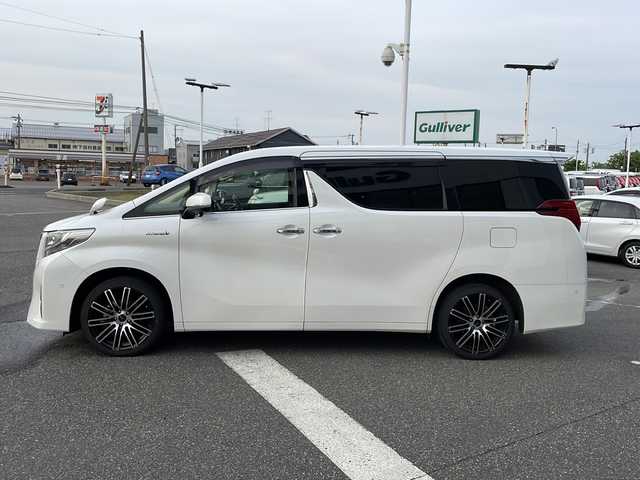 トヨタ アルファードハイブリット G 新潟県 2016(平28)年 11万km ホワイトパールクリスタルシャイン メーカーオプションナビ/フルセグTV/BT/CD/DVD/AUX/バックカメラ/JBL/両側パワースライドドア/フリップダウンモニター/レーダークルーズコントロール/ETC/4WD/オットマン/D＋N席　パワーシート/ドライブレコーダー前後/ナノイーエアコン/スペアキー1本/スマートキー/社外19インチアルミホイール/ウォークスルー