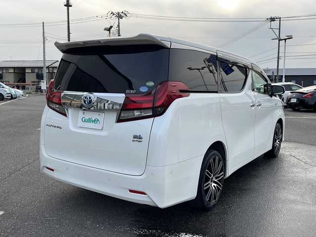 トヨタ アルファードハイブリット G 新潟県 2016(平28)年 11万km ホワイトパールクリスタルシャイン メーカーオプションナビ/フルセグTV/BT/CD/DVD/AUX/バックカメラ/JBL/両側パワースライドドア/フリップダウンモニター/レーダークルーズコントロール/ETC/4WD/オットマン/D＋N席　パワーシート/ドライブレコーダー前後/ナノイーエアコン/スペアキー1本/スマートキー/社外19インチアルミホイール/ウォークスルー