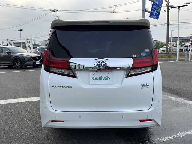 トヨタ アルファードハイブリット G 新潟県 2016(平28)年 11万km ホワイトパールクリスタルシャイン メーカーオプションナビ/フルセグTV/BT/CD/DVD/AUX/バックカメラ/JBL/両側パワースライドドア/フリップダウンモニター/レーダークルーズコントロール/ETC/4WD/オットマン/D＋N席　パワーシート/ドライブレコーダー前後/ナノイーエアコン/スペアキー1本/スマートキー/社外19インチアルミホイール/ウォークスルー
