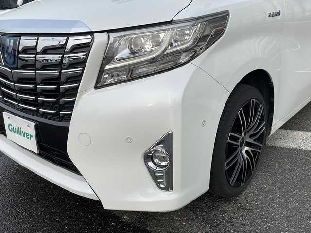 トヨタ アルファードハイブリット G 新潟県 2016(平28)年 11万km ホワイトパールクリスタルシャイン メーカーオプションナビ/フルセグTV/BT/CD/DVD/AUX/バックカメラ/JBL/両側パワースライドドア/フリップダウンモニター/レーダークルーズコントロール/ETC/4WD/オットマン/D＋N席　パワーシート/ドライブレコーダー前後/ナノイーエアコン/スペアキー1本/スマートキー/社外19インチアルミホイール/ウォークスルー