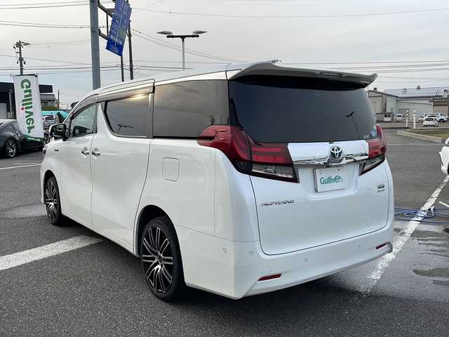 トヨタ アルファードハイブリット G 新潟県 2016(平28)年 11万km ホワイトパールクリスタルシャイン メーカーオプションナビ/フルセグTV/BT/CD/DVD/AUX/バックカメラ/JBL/両側パワースライドドア/フリップダウンモニター/レーダークルーズコントロール/ETC/4WD/オットマン/D＋N席　パワーシート/ドライブレコーダー前後/ナノイーエアコン/スペアキー1本/スマートキー/社外19インチアルミホイール/ウォークスルー