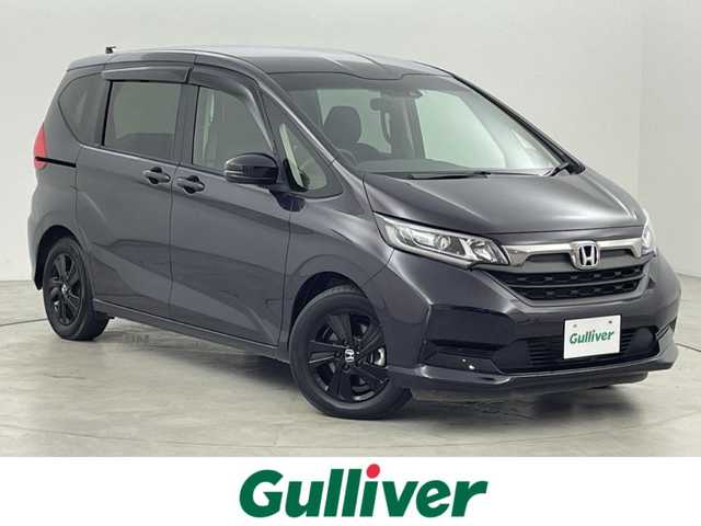 ホンダ フリード ハイブリット G ブラックスタイル 福岡県 2022(令4)年 2.1万km トワイライトミストブラックパール ワンオーナー　/純正８型ナビ／フルセグＴＶ　/TVキャンセラー　/バックカメラ　/前後ドラレコ　/ＥＴＣ　/レーダークルーズコントロール　/コーナーセンサー　/衝突被害軽減ブレーキ　/レーンキープ　/両側電動スライドドア　/シートヒーター　/純正１５インチアルミホイール　/LEDヘッドライト