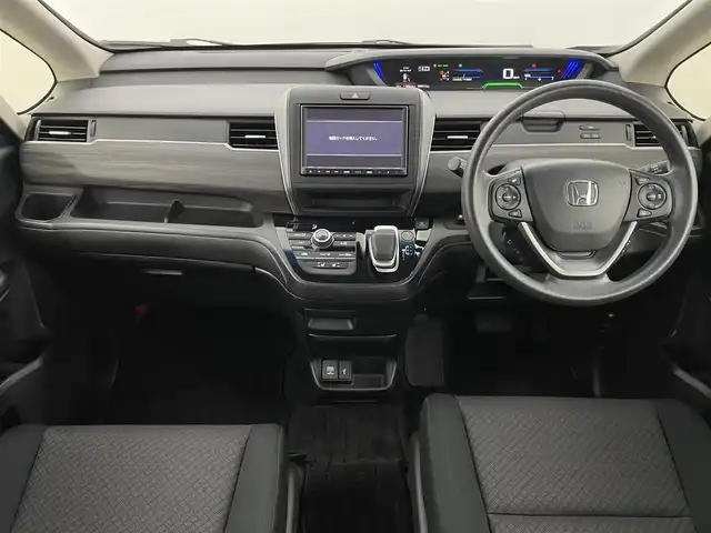 ホンダ フリード ハイブリット G ブラックスタイル 福岡県 2022(令4)年 2.1万km トワイライトミストブラックパール ワンオーナー　/純正８型ナビ／フルセグＴＶ　/TVキャンセラー　/バックカメラ　/前後ドラレコ　/ＥＴＣ　/レーダークルーズコントロール　/コーナーセンサー　/衝突被害軽減ブレーキ　/レーンキープ　/両側電動スライドドア　/シートヒーター　/純正１５インチアルミホイール　/LEDヘッドライト