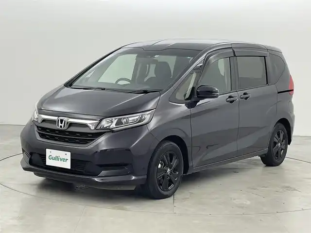 ホンダ フリード ハイブリット G ブラックスタイル 福岡県 2022(令4)年 2.1万km トワイライトミストブラックパール ワンオーナー　/純正８型ナビ／フルセグＴＶ　/TVキャンセラー　/バックカメラ　/前後ドラレコ　/ＥＴＣ　/レーダークルーズコントロール　/コーナーセンサー　/衝突被害軽減ブレーキ　/レーンキープ　/両側電動スライドドア　/シートヒーター　/純正１５インチアルミホイール　/LEDヘッドライト