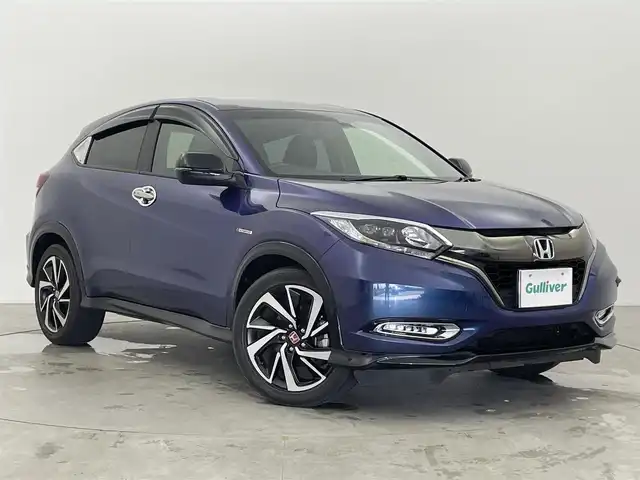 ホンダ ヴェゼル ハイブリッド RS ホンダセンシング 富山県 2016(平28)年 3.3万km モルフォブルーP 純正ナビ(AM/FM/CD/DVD/BT/USB)/ワンセグTV/バックカメラ/レーダークルーズコントロール/レーンキープアシスト/衝突軽減装置/アイドリングストップ/オートブレーキホールド/ETC/盗難防止装置/横滑り防止装置/LEDヘッドライト/革巻きステアリング/ハーフレザーシート/パドルシフト/オートライト/フォグランプ/純正AW/純正フロアマット/革巻きステアリング/スマートキー/スペアキー1本/プッシュスタート/取扱説明書