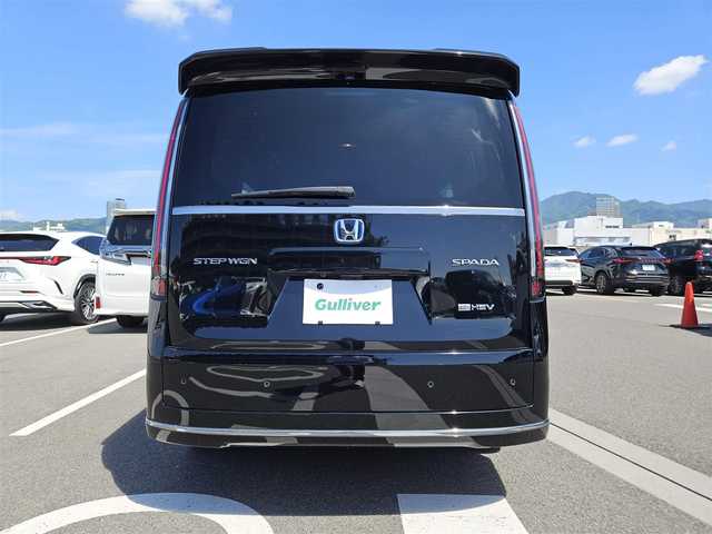 ホンダ ステップワゴン スパーダ eHEV 香川県 2022(令4)年 3.9万km クリスタルブラックパール ワンオーナー/純正11.4型ナビ/　(Bluetooth/CD/DVD)/フルセグTV/両側パワースライドドア/バックカメラ/ビルトインETC/渋滞追従機能付アダプティブクルコン/ソナーセンサー/ホンダセンシング/・衝突軽減ブレーキ/・近距離衝突軽減ブレーキ/・前後誤発進抑制機能/・歩行者事故低減ステアリング/・車線維持支援システム/・トラフィックジャムアシスト/・先行車発進お知らせ機能/・標識認識機能/・オートハイビーム/・ブラインドスポットインフォメーション/LEDヘッドランプ/デュアルオートエアコン/本革巻きステアリング/減速セレクター/合皮/撥水ファブリックコンビシート/前席シートヒーター/2列目キャプテンシート/　(オットマン/両側アームレスト付)/純正16インチアルミホイール/スマートキーシステム/禁煙車