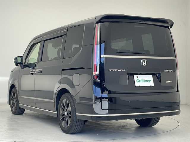ホンダ ステップワゴン スパーダ eHEV 沖縄県 2022(令4)年 3.9万km クリスタルブラックパール ワンオーナー/純正11.4型ナビ/　(Bluetooth/CD/DVD)/フルセグTV/両側パワースライドドア/バックカメラ/ビルトインETC/渋滞追従機能付アダプティブクルコン/ソナーセンサー/ホンダセンシング/衝突軽減ブレーキ/近距離衝突軽減ブレーキ/前後誤発進抑制機能/歩行者事故低減ステアリング/車線維持支援システム/トラフィックジャムアシスト/先行車発進お知らせ機能/標識認識機能/オートハイビーム/ブラインドスポットインフォメーション/LEDヘッドランプ/デュアルオートエアコン/本革巻きステアリング/減速セレクター/合皮/撥水ファブリックコンビシート/前席シートヒーター/2列目キャプテンシート/　(オットマン/両側アームレスト付)/純正16インチアルミホイール/スマートキーシステム