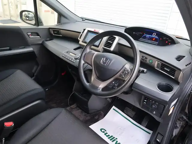 ホンダ フリード スパイク ハイブリット ジャストセレクション 石川県 2013(平25)年 10.8万km プレミアムブラキッシュパール スマートキー/スペアキー/オートライト/HIDライト/クルーズコントロール/社外ナビゲーション/フルセグテレビ/Bluetooth/USB/HDMIケーブル/左片側パワースライドドア/アイドリングストップ/ETC/電動格納ミラー/純正フロアマット