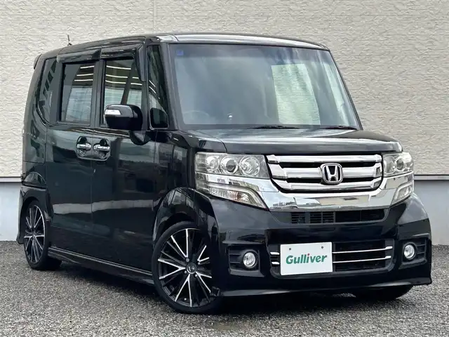 ホンダ Ｎ ＢＯＸ カスタム G Lパッケージ 大阪府 2015(平27)年 9.5万km スマートブラック 社外メモリナビ（AVIC-ZH0999）/BT/CD/DVD/フルセグTV/iPod/両側パワースライドドア/バックカメラ/アイドリングストップ/オートライト/横滑り防止装置/プッシュスタート/後席ロールサンシェード/シートバックテーブル/純正フロアマット/フロントフォグランプ/車高調（TEIN）/ETC