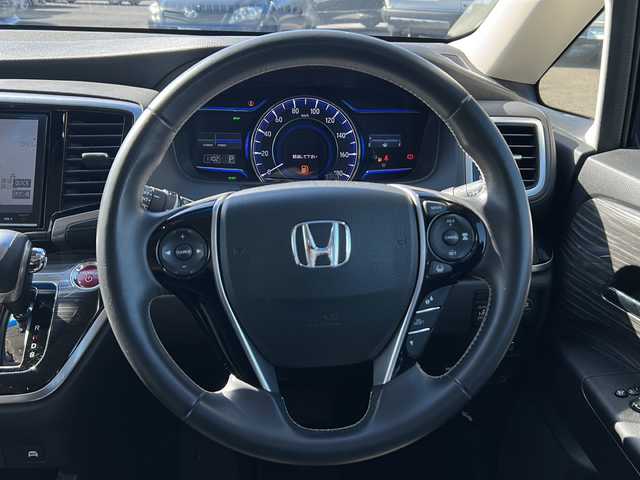 ホンダ オデッセイ ハイブリッド アブソルート ホンダセンシング 茨城県 2017(平29)年 9.2万km プレミアムヴィーナスブラックP 純正ナビ（VXM-175VFEi）/【フルセグTV/CD/DVD/Bluetooth】/バックカメラ/純正フリップダウンモニター/両側パワースライドドア/ホンダセンシング/衝突軽減ブレーキ/レーダークルーズコントロール/レーンキープアシスト/先行車発進お知らせ機能/横滑り防止装置/ECON/黒ハーフレザーシート/運転席パワーシート/純正17インチAW/オートライト/LEDヘッドライト/フォグランプ/革巻きステアリング/ステアリングスイッチ