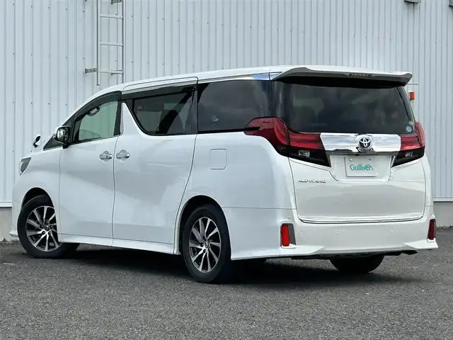 トヨタ アルファード S Cパッケージ 熊本県 2015(平27)年 7.1万km ホワイトパールクリスタルシャイン 社外ナビ（ALPINE）/・AM/FM/CD/DVD/SD/USB/HDMI/BT/・フルセグTV/バックカメラ/横滑り防止機能/クリアランスソナー/クルーズコントロール/前後コーナーセンサー/革巻きステアリング/・ステアリングリモコン/・ステアリングヒーター/レザーシート/・D/N席パワーシート/・D席シートメモリー/・N席＋二列目オットマン/オートライト/・LEDライト/・フォグランプ/フリップダウンモニター（ALPINE）/電動格納ミラー/・ウィンカーミラー/前後ドライブレコーダー（ZDR016）/電動サイドブレーキ/・ホールドボタン/パワーバックドア/ETC/ドアバイザー/純正アルミホイール/社外フロアマット/スマートキー/・スペアキー/社外フロアマット