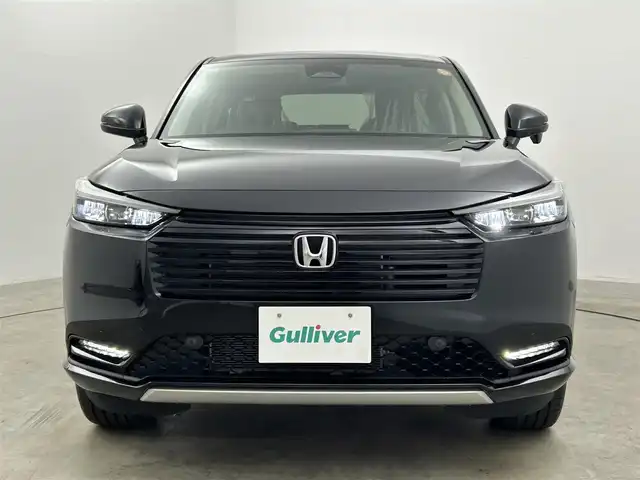 ホンダ ヴェゼル ハイブリッド e:HEV Z 岡山県 2025(令7)年 0.1千km クリスタルブラックパール 登録済未使用車/Honda CONNECT9インチディスプレー/【Bluetooth/フルセグTV/Carplay】/ワイヤレス充電　/ビルトインETC2.0/バックカメラ/パドルシフト/Honda SENSING/・トラフィックジャムアシスト/・アダプティブドライビングビーム/・急アクセル抑制機能/・衝突軽減ブレーキ（CMBS）/・渋滞追従機能付アダプティブクルーズコントロール（ACC）/・車線維持支援システム（LKAS）/・ブラインドスポットインフォメーション/セーフティ・サポートカーS〈ワイド〉/ステアリングヒーター/運転席＆助手席シートヒーター/オートブレーキホールド/スマートキー×2/新車保証書/取扱説明書/ナビ取扱説明書