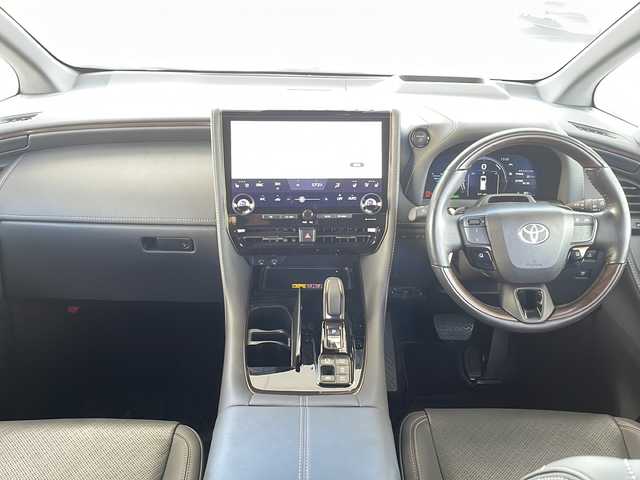 トヨタ ヴェルファイア ハイブリット Z プレミア 愛知県 2024(令6)年 2万km プラチナホワイトパールマイカ ワンオーナー/左右独立ムーンルーフ/トヨタチームメイト/【アドバンストパーク・パーキングサポートブレーキ（周辺静止物）・アドバンストドライブ・緊急時操舵支援・フロントクロストラフィックアラート・レーンチェンジアシスト・ドライバーモニターカメラ】/Toyota Safety Sense/【プリクラッシュセーフティ・レーントレーシングアシスト・全車速追従機能付レーダークルーズコントロール・アダプティブハイビームシステム/・ロードサインアシスト・ドライバー異常時対応システム・プロアクティブドライビングアシスト・発進遅れ告知機能・BSM】/パーキングサポートブレーキ/デジタルインナーミラー/14インチディスプレイオーディオ/【車載ナビ・地デジTV・Mira cast】/純正フリップダウンモニター/ETC2.0/パノラミックビューモニター/ヘッドアップディスプレイ/両側パワースライドドア/パワーバックドア/本革シート/シートヒーター/ベンチレーション/ステアリングヒーター/置くだけ充電/新車保証書/スペアキーあり