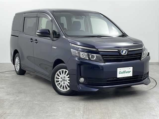 トヨタ ヴォクシー ハイブリッド V 三重県 2017(平29)年 3.2万km ブラッキッシュアゲハガラスフレーク 純正9型ナビ/【CD/DVD/SD/Bluetooth】/地デジ対応TV/バックカメラ/純正後席モニター/トヨタセーフティセンス/PCS/LKA/片側パワースライドドア/LEDヘッドライト/オートライト機能/ビルトインETC/革巻きステア/リモコン/クルーズコントロール/前席シートヒーター/ワンオーナー