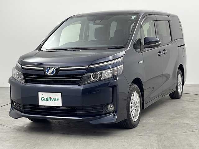 トヨタ ヴォクシー ハイブリッド V 三重県 2017(平29)年 3.2万km ブラッキッシュアゲハガラスフレーク 純正9型ナビ/【CD/DVD/SD/Bluetooth】/地デジ対応TV/バックカメラ/純正後席モニター/トヨタセーフティセンス/PCS/LKA/片側パワースライドドア/LEDヘッドライト/オートライト機能/ビルトインETC/革巻きステア/リモコン/クルーズコントロール/前席シートヒーター/ワンオーナー
