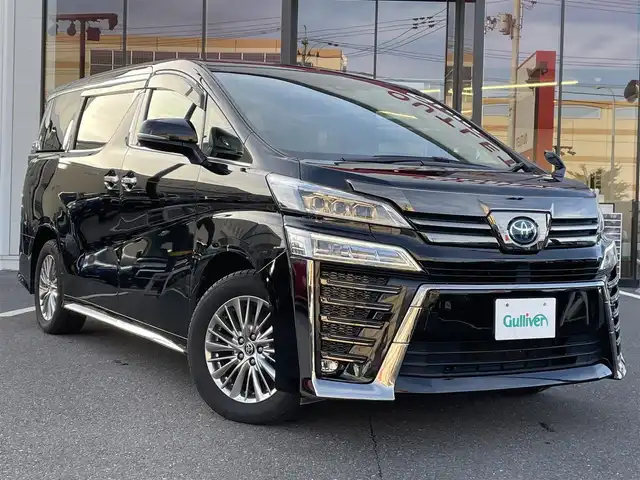 トヨタ ヴェルファイア ハイブリット ゴールデンアイズⅡ 宮城県 2021(令3)年 5.6万km ブラック 登録時走行距離55192km/後席モニター/1オーナー/ディーラーオプションナビ/フルセグTV/CD/DVD/Bluetooth/バックカメラ/3眼LEDヘッドライト/シーケンシャルウインカー/レーンキープ/追従クルーズコントロール/両側パワースライド/衝突軽減ブレーキ/プッシュスタート/スマートキー/ドライブレコーダー/ETC/ACC/オートハイビーム/パワーバックドア/ハーフレザーシート
