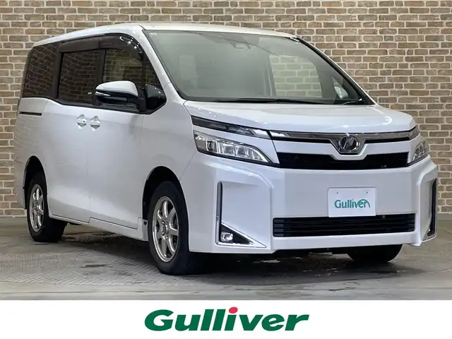 トヨタ ヴォクシー X 岩手県 2017(平29)年 11.5万km ホワイトパールクリスタルシャイン ４WD/クルーズコントロール/両側パワースライドドア/トヨタセーフティセンスC/プリクラッシュセーフティ/レーンディパーチャーアラート/オートマチックハイビーム/先行車発進告知/横滑り防止装置/アイドリングストップ/MTモード付AT/リアサンシェード/エンジンスターター/純正ナビ/バックカメラ/ワンセグTV/ステアリングスイッチ/ETC/LEDヘッドランプ/フォグランプ/社外１５インチアルミホイール