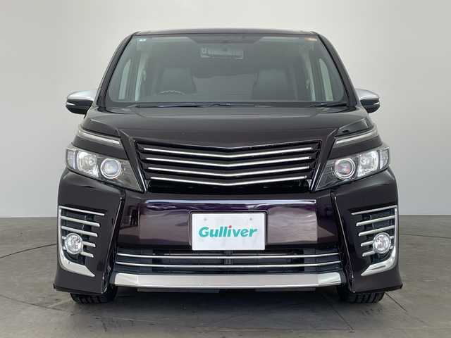 トヨタ ヴォクシー ZS 兵庫県 2014(平26)年 8万km ボルドーマイカメタリック ・社外8インチナビ&BT&CD&DVD&TV&USB&SD/・バックカメラ/・フリップダウンモニター/・両側パワースライドドア/・アイドリングストップ/・横滑り防止装置/・ドライブスタートコントロール/・S－VSC/・MTモード付AT/・ステアリングスイッチ/・レザー調シートカバー/・フロアマット/・ミラー型前後ドライブレコーダー/・ビルトインETC/・社外スピーカー/・オートミラー/・モデリスタマフラー/・TRDダウンサスペンション/・社外テールランプ/・LEDヘッドライト/・フォグランプ/・エンジンスターター/・スペアキー/・取扱説明書/・保証書