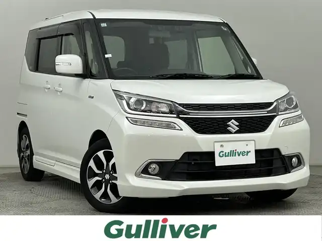 スズキ ソリオ バンディット HV MV Dカメラ ブレーキS 道央・札幌 2017(平29)年 2万km ピュアホワイトP ・４ＷＤ/・純正ナビ/・バックカメラ/・衝突軽減ブレーキ/・フルセグＴＶ＆Ｂｌｕｅｔｏｏｔｈ＆ＣＤ＆ＤＶＤ/・シートヒーター/・オートライト/・ＥＴＣ/・クルーズコントロール/・オートエアコン/・スマートキー＆プッシュスタート/・レーンアシスト/・横滑り防止機能/・片側パワースライドドア/・ミラーヒーター/・純正アルミホイール/・純正フロアマット/・ＬＥＤヘッドライト/・盗難防止システム/・Ｗエアバック