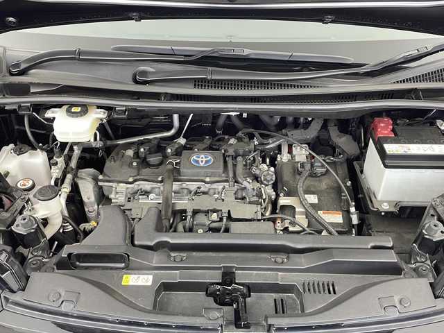 トヨタ ヴォクシー ハイブリッド S－Z 熊本県 2023(令5)年 2.5万km グリッターブラックガラスフレーク メーカーオプション10.5インチディスプレイナビ【Bluetooth フルセグテレビ】/快適利便パッケージMid/14インチフリップダウンモニター/バックカメラ/ドライブレコーダー/両側パワースライドドア/ETC2.0/レーダークルーズコントロール/衝突軽減/レーンキープアシスト/LEDライト/オートライト/オートマチックハイビーム/パワーバックドア/ハーフレザーシート/シートヒーター【D+N席】/オットマン/ウォークスルー/純正フロアマット/純正アルミホイール/禁煙車