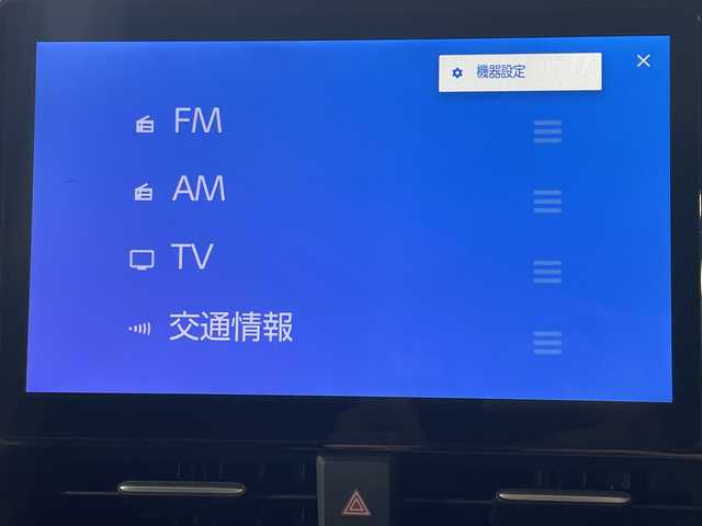トヨタ ヴォクシー ハイブリッド S－Z 神奈川県 2025(令7)年 0.1千km ホワイトパールクリスタルシャイン 登録済未使用車/ディスプレイオーディオプラス/純正10.5型ディスプレーオーディオ/メモリーナビ/フルセグ　CD DVD USB　HDMI　Miracast　Bluetooth　Applecarplay　Androidauto　ETC2.0/バックカメラ/両側電動スライドドア/パワーバックドア/ドライビングサポートパッケージ/快適利便パッケージ/セーフティセンス/プリクラッシュセーフティ/レーンディパーチャーアラート/オートマチックハイビーム/ドライバー異常時対応システム/発進遅れ告知機能/レーントレーシングアシスト/レーダークルーズコントロール/ロードサインアシスト/パーキングサポートブレーキ/車両接近通報装置/プロアクティブドライビングアシスト/カラーヘッドアップディスプレイ/デジタルインナーミラー/ナノイーX/ステアリングヒーター/前席/2列目左右シートヒーター/ステアリングヒーター/合皮/ファブリックコンビシート/革巻きステアリング/AC100V/SOSコール/プッシュスタート/スマートキー/LEDヘッドライト/オートライト/純正17インチアルミホイール/純正サイド/リアスポイラー
